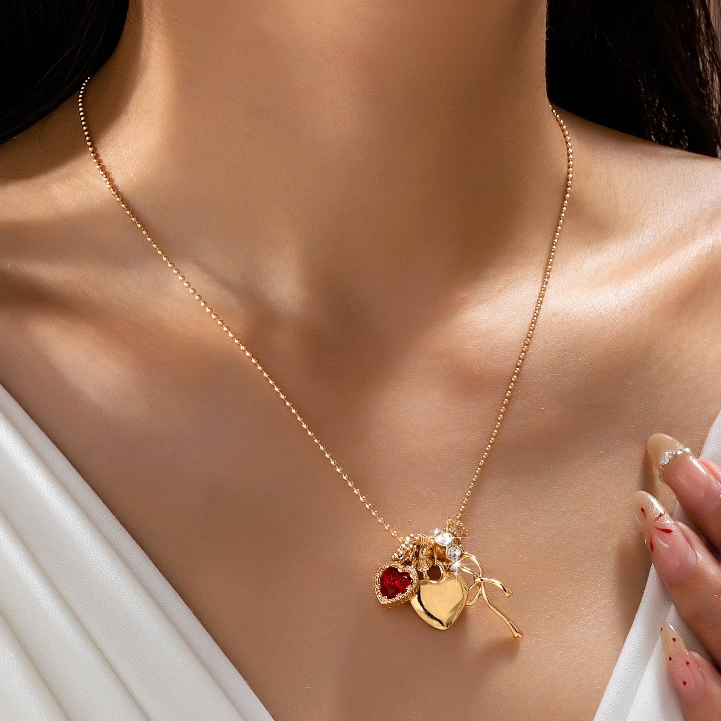 Multi-Charm Heart and Bow Necklace | 80N92882